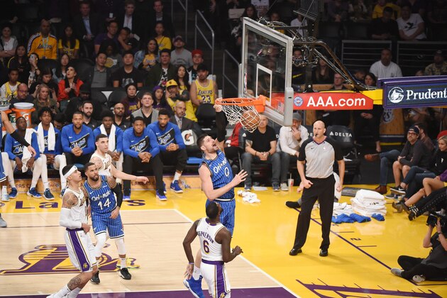 LOS ANGELES, CA - NOVEMBER 25: Nikola Vucevic #9 of the Orlando Magic drives to the basket during the game against the Los Angeles Lakers on November 25, 2018 at STAPLES Center in Los Angeles, California. NOTE TO USER: User expressly acknowledges and agrees that, by downloading and/or using this Photograph, user is consenting to the terms and conditions of the Getty Images License Agreement. Mandatory Copyright Notice: Copyright 2018 NBAE (Photo by Adam Pantozzi/NBAE via Getty Images)
