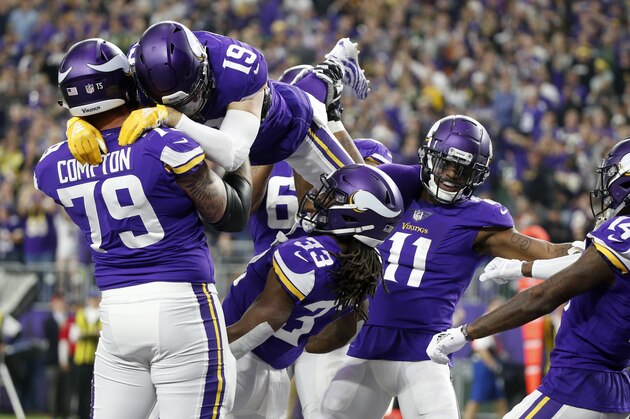 Minnesota Vikings running back Dalvin Cook (33) celebrates with teammates after catching a 26-yard touchdown pass during the first half of an NFL football game against the Green Bay Packers, Sunday, Nov. 25, 2018, in Minneapolis. (AP Photo/Bruce Kluckhohn)