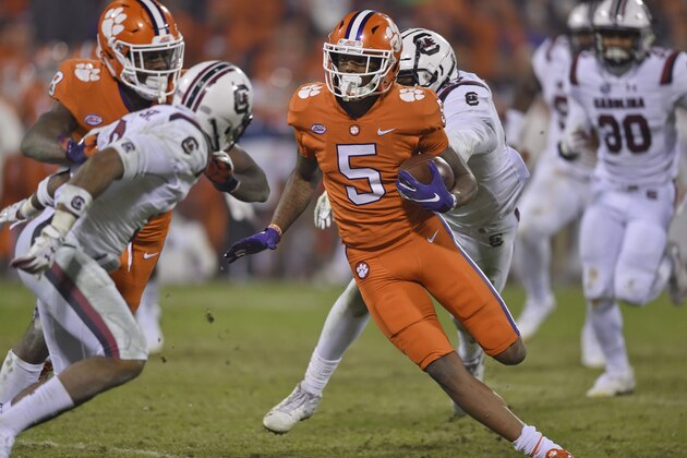 Clemson's Tee Higgins (5) outruns the tackle attempt by South Carolina's R.J. Roderick uring the second half of an NCAA college football game Saturday, Nov. 24, 2018, in Clemson, S.C. Clemson won 56-35. (AP Photo/Richard Shiro)