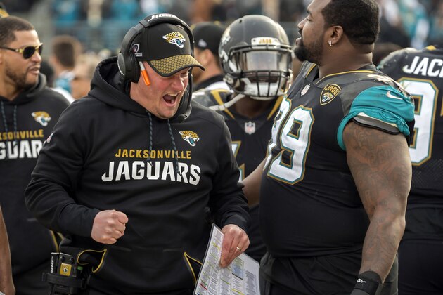 Jacksonville Jaguars offensive coordinator Nathaniel Hackett celebrates with Jaguars defensive tackle Marcell Dareus (99) during the second half of an NFL wild-card playoff football game against the Buffalo Bills, Sunday, Jan. 7, 2018, in Jacksonville, Fla. Jaguars beat the Bills 10-3. (AP Photo/Stephen B. Morton)