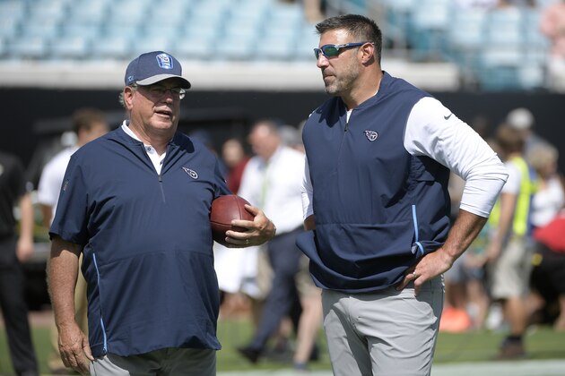 Tennessee Titans head coach Mike Vrabel, right, talks with defensive coordinator Dean Pees during warmups before an NFL football game against the Jacksonville Jaguars Sunday, Sept. 23, 2018, in Jacksonville, Fla. (AP Photo/Phelan M. Ebenhack)