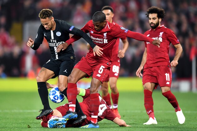 LIVERPOOL, ENGLAND - SEPTEMBER 18:  Neymar of Paris Saint-Germain battles with Georginio Wijnaldum and Jordan Henderson of Liverpool during the Group C match of the UEFA Champions League between Liverpool and Paris Saint-Germain at Anfield on September 18, 2018 in Liverpool, United Kingdom.  (Photo by Michael Regan/Getty Images)