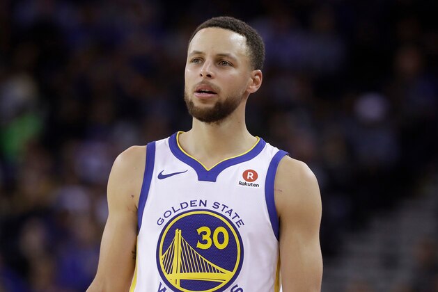 FILE - This March 6, 2018 file photo shows Golden State Warriors guard Stephen Curry during an NBA basketball game against the Brooklyn Nets in Oakland, Calif.  Sony Pictures Entertainment announced Monday, April 23, that it has struck a deal with the Golden State Warriors All-Star guard to produce television, film and possibly gaming projects. (AP Photo/Jeff Chiu, File)