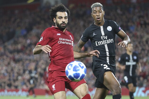 LIVERPOOL, ENGLAND - SEPTEMBER 18: Mohamed Salah of Liverpool, Presnel Kimpembe of PSG during the Group C match of the UEFA Champions League between Liverpool FC and Paris Saint-Germain (PSG) at Anfield on September 18, 2018 in Liverpool, United Kingdom. (Photo by Jean Catuffe/Getty Images)
