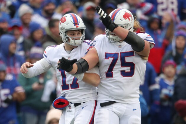 BUFFALO, NY - NOVEMBER 25: Josh Allen #17 of the Buffalo Bills celebrates with Wyatt Teller #75 after throwing a touchdown in the first quarter during NFL game action against the Jacksonville Jaguars at New Era Field on November 25, 2018 in Buffalo, New York. (Photo by Tom Szczerbowski/Getty Images)