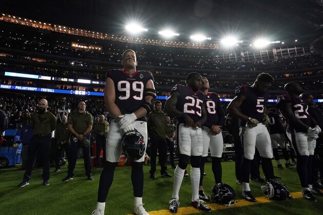 Houston Texans players take part in a tribute to Houston Texans owner Robert