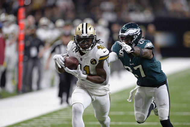New Orleans Saints running back Alvin Kamara (41) pulls in a touchdown reception in front of Philadelphia Eagles strong safety Malcolm Jenkins (27) during the second half of an NFL football game in New Orleans, Sunday, Nov. 18, 2018. The Saints won 48-7. (AP Photo/Bill Feig)