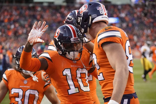 Denver Broncos wide receiver Emmanuel Sanders (10) celebrates his touchdown with tight end Jeff Heuerman (82) during the first half of an NFL football game against the Pittsburgh Steelers, Sunday, Nov. 25, 2018, in Denver. (AP Photo/Jack Dempsey)