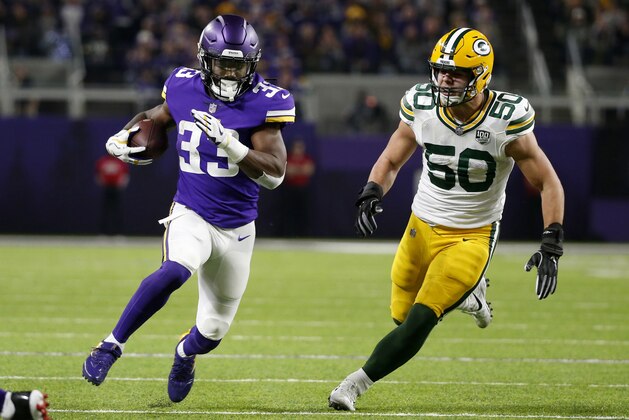 Minnesota Vikings running back Dalvin Cook (33) runs from Green Bay Packers inside linebacker Blake Martinez (50) during the first half of an NFL football game, Sunday, Nov. 25, 2018, in Minneapolis. (AP Photo/Bruce Kluckhohn)