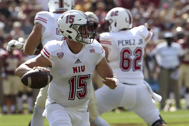 Northern Illinois' Marcus Childers looks for a receiver in the first quarter of an NCAA college football game with Florida State, Saturday, Sept. 22, 2018, in Tallahassee Fla. (AP Photo/Steve Cannon)