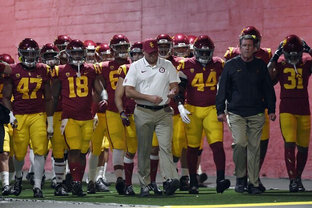 LOS ANGELES, CA - NOVEMBER 24: Head coach Clay Helton of the USC Trojans walks his team down the tunnel at Los Angeles Memorial Coliseum to play against the Notre Dame Fighting Irish on November 24, 2018 in Los Angeles, California. (Photo by Kevork Djansezian/Getty Images)