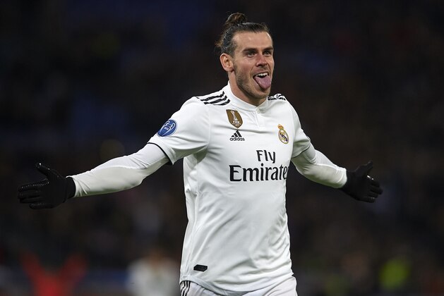 ROME, ITALY - NOVEMBER 27: Gareth Bale of Real Madrid celebrates after scoring his sides first goal during the Group G match of the UEFA Champions League between AS Roma and Real Madrid  at Stadio Olimpico on November 27, 2018 in Rome, Italy. (Photo by Quality Sport Images/Getty Images)
