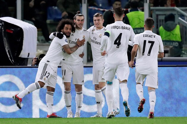 ROME, ITALY - NOVEMBER 27: Gareth Bale of Real Madrid celebrates 0-1 with Marcelo of Real Madrid, Toni Kroos of Real Madrid, Sergio Ramos of Real Madrid, Lucas Vazquez of Real Madrid  during the UEFA Champions League  match between AS Roma v Real Madrid at the Stadio Olimpico Rome on November 27, 2018 in Rome Italy (Photo by David S. Bustamante/Soccrates/Getty Images)
