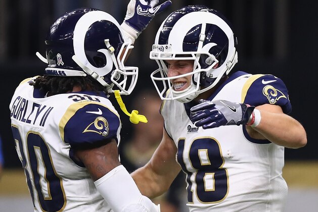 NEW ORLEANS, LA - NOVEMBER 04:  Cooper Kupp #18 of the Los Angeles Rams celebrates his touchdown with teammate Todd Gurley II #30 during the fourth quarter of the game against the New Orleans Saints at Mercedes-Benz Superdome on November 4, 2018 in New Orleans, Louisiana.  (Photo by Gregory Shamus/Getty Images)