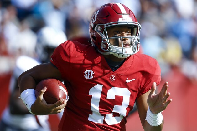 Alabama quarterback Tua Tagovailoa (13) carries the ball during the first half of an NCAA college football game against Citadel, Saturday, Nov. 17, 2018, in Tuscaloosa, Ala. (AP Photo/Butch Dill)