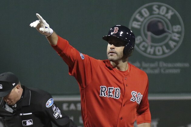 Boston Red Sox's J.D. Martinez celebrates after his three-run home run during the first inning of Game 1 of a baseball American League Division Series against the New York Yankees on Friday, Oct. 5, 2018, in Boston. (AP Photo/Elise Amendola)