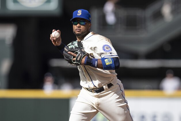 SEATTLE, WA - SEPTEMBER 9: Second baseman Robinson Cano #22 of the Seattle Mariners throws to first base after fielding a ground ball during a game against the New York Yankeesat Safeco Field on September 9, 2018 in Seattle, Washington. The Mariners won 3-2. (Photo by Stephen Brashear/Getty Images)