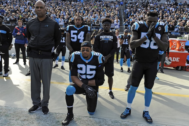 Carolina Panthers' Eric Reid (25) kneels during the national anthem before an NFL football game against the Seattle Seahawks in Charlotte, N.C., Sunday, Nov. 25, 2018. (AP Photo/Mike McCarn)