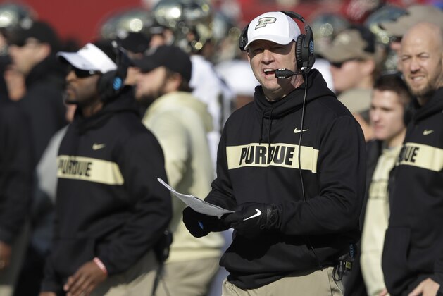 FILE - In this Nov. 24, 2018, file photo, Purdue coach Jeff Brohm watches his team play Indiana during an NCAA college football game in Bloomington, Ind. One day after reportedly meeting with Louisville officials in central Indiana, Brohm informed Boilermakers athletic director Mike Bobinski he was turning down the Cardinals job so he could stay in West Lafayette. (AP Photo/Darron Cummings, File)