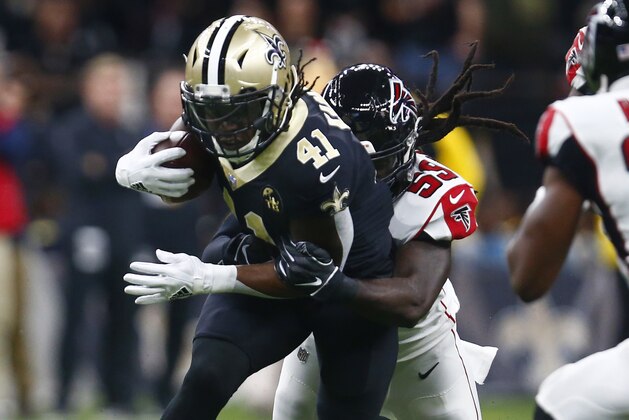 New Orleans Saints running back Alvin Kamara (41) carries against Atlanta Falcons outside linebacker De'Vondre Campbell (59) in the first half of an NFL football game in New Orleans, Thursday, Nov. 22, 2018. (AP Photo/Butch Dill)
