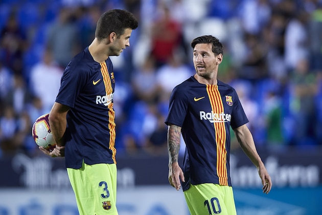 LEGANES, SPAIN - SEPTEMBER 26:  Leo Messi (R) of FC Barcelona speaks with Gerard Pique of FC Barcelona prior to the La Liga match between CD Leganes and FC Barcelona at Estadio Municipal de Butarque on September 26, 2018 in Leganes, Spain. (Photo by Quality Sport Images/Getty Images)