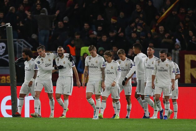 ROME, ITALY - NOVEMBER 27:  Lucas Vazquez with his teammates of Real Madrid celebrates after scoring the team's second goal during the group G match of the UEFA Champions League between AS Roma and Real Madrid at Stadio Olimpico on November 27, 2018 in Rome, Italy.  (Photo by Paolo Bruno/Getty Images)