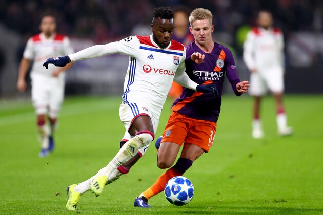 LYON, FRANCE - NOVEMBER 27: Maxwell Cornet of Olympique Lyonnais is challenged by Oleksandr Zinchenko of Manchester City during the Group F match of the UEFA Champions League between Olympique Lyonnais and Manchester City at Groupama Stadium on November 27, 2018 in Lyon, France. (Photo by Clive Rose/Getty Images)