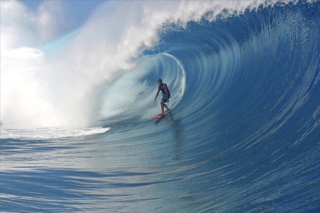 TAHITI, FRENCH POLYNESIA - APRIL 30:  Bruce Irons of Hawaii, USA, rides the tube at the Air TahitiNui VZ Trials April 30, 2003 at Teahupoo, Tahiti, French Polynesia. Three wildcards will be awarded to the top two placed Tahitians and the next highest placed surfer in the Air TahitiNui VZ Trials. The wildcards will then be seeded into the Billabong Pro which features the top 45 ASP surfers in the world. The Billabong Pro is the third event on the 2003 ASP WCT and starts from May 6 ? 18, 2003. (Photo by Steve Robertson/Getty Images)
