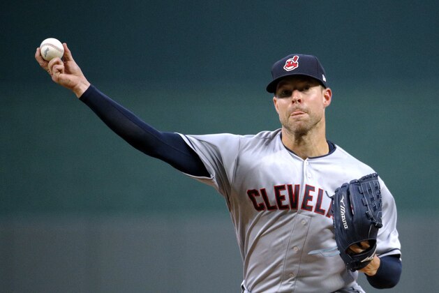 Cleveland Indians starting pitcher Corey Kluber throws during the first inning of a baseball game against the Kansas City Royals on Saturday, Sept. 29, 2018, in Kansas City, Mo. (AP Photo/Charlie Riedel)