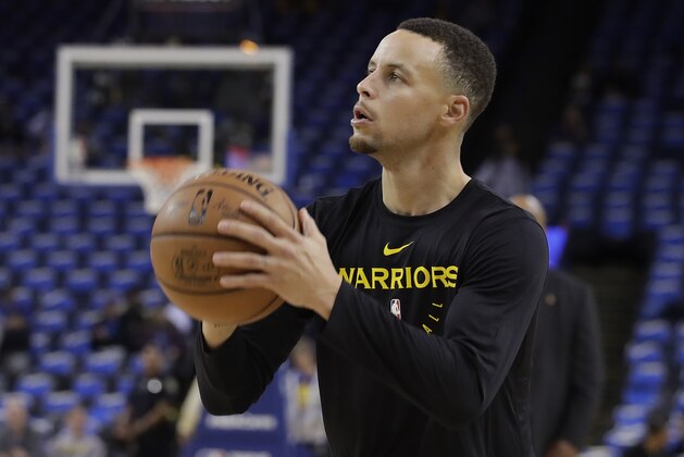 Golden State Warriors guard Stephen Curry warms up before an NBA basketball game between the Warriors and the Oklahoma City Thunder in Oakland, Calif., Wednesday, Nov. 21, 2018. (AP Photo/Jeff Chiu)