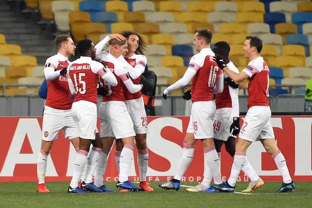 Arsenal players celebrate a goal during UEFA Europa League, Group E, football match Vorskla FC vs Arsenal FC at the Olympiyski Stadium in Kiev on November 29, 2018. (Photo by SERGEI SUPINSKY / AFP)        (Photo credit should read SERGEI SUPINSKY/AFP/Getty Images)