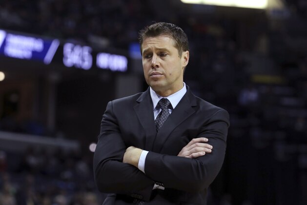Sacramento Kings coach Dave Joerger reacts to a call during the first half of the team's NBA basketball game against the Memphis Grizzlies on Friday, Nov. 16, 2018, in Memphis, Tenn. (AP Photo/Karen Pulfer Focht)