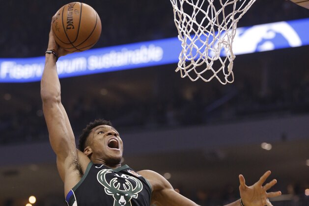 Milwaukee Bucks' Giannis Antetokounmpo dunks against the Phoenix Suns during the first half of an NBA basketball game Friday, Nov. 23, 2018, in Milwaukee. (AP Photo/Jeffrey Phelps) Milwaukee Bucks' Giannis Antetokounmpo dunks against the Phoenix Suns during the first half of an NBA basketball game Friday, Nov. 23, 2018, in Milwaukee. (AP Photo/Jeffrey Phelps)