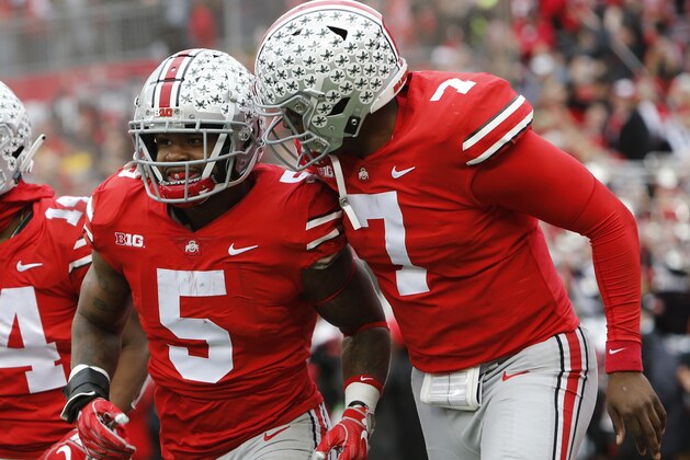 Ohio State running back Mike Weber, left, celebrates his touchdown against Michigan with teammate quarterback Dwayne Haskins during the second half of an NCAA college football game Saturday, Nov. 24, 2018, in Columbus, Ohio. Ohio State beat Michigan 62-39. (AP Photo/Jay LaPrete)