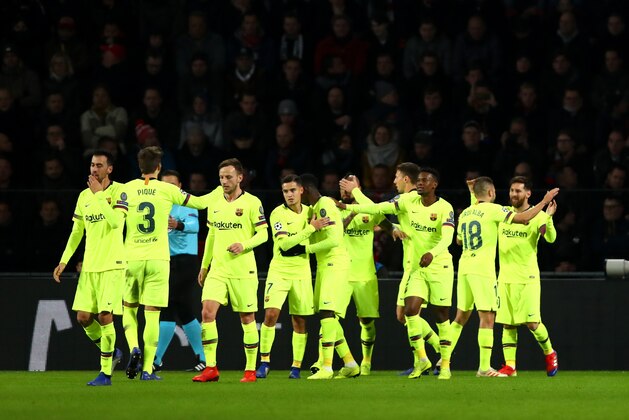 EINDHOVEN, NETHERLANDS - NOVEMBER 28:  Lionel Messi of Barcelona celebrates with teammates after scoring his sides first goal during the UEFA Champions League Group B match between PSV Eindhoven and FC Barcelona at Philips Stadion on November 28, 2018 in Eindhoven, Netherlands.  (Photo by Dean Mouhtaropoulos/Getty Images)