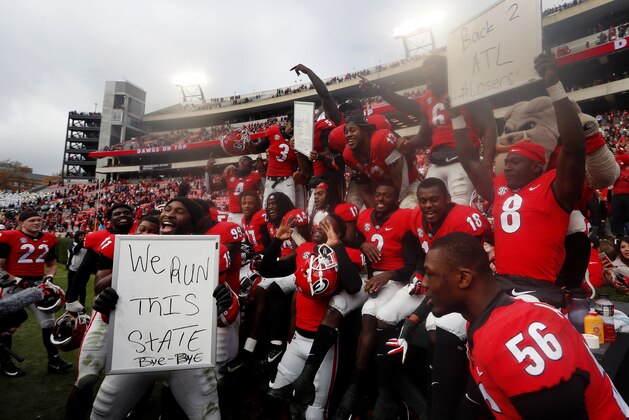 Georgia players celebrate after defeating Georgia Tech 45-21 in an NCAA college football game Saturday, Nov. 24, 2018, in Athens, Ga. (AP Photo/John Bazemore)