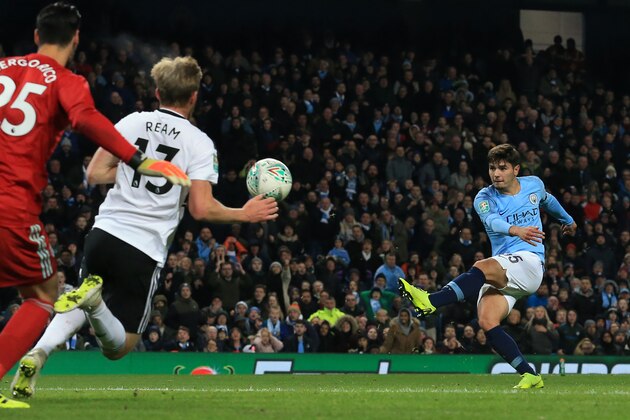 Manchester City's Spanish-born midfielder Brahim Diaz (R) shoots to score their second goal during the English League Cup, 4th round football match between Manchester City and Fulham at the Etihad Stadium in Manchester, north west England, on November 1, 2018. (Photo by Lindsey PARNABY / AFP) / RESTRICTED TO EDITORIAL USE. No use with unauthorized audio, video, data, fixture lists, club/league logos or 'live' services. Online in-match use limited to 120 images. An additional 40 images may be used in extra time. No video emulation. Social media in-match use limited to 120 images. An additional 40 images may be used in extra time. No use in betting publications, games or single club/league/player publications. /         (Photo credit should read LINDSEY PARNABY/AFP/Getty Images)