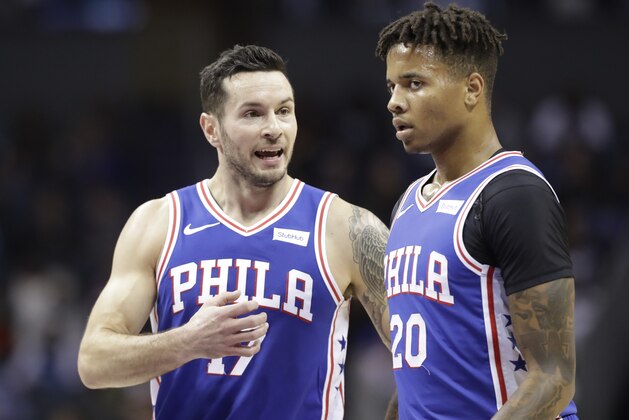 Philadelphia 76ers' JJ Redick (17) talks with Markelle Fultz (20) during the first half of an NBA basketball game against the Charlotte Hornets in Charlotte, N.C., Saturday, Nov. 17, 2018. (AP Photo/Chuck Burton)