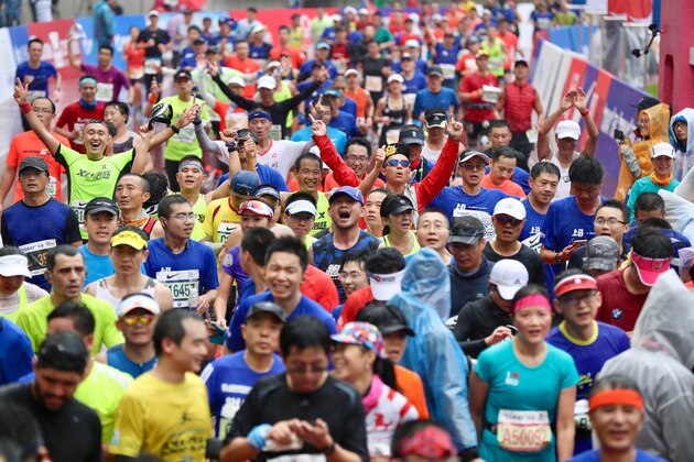 Runners take part in the Shanghai International Marathon in Shanghai on November 18, 2018. (Photo by - / AFP) / China OUT        (Photo credit should read -/AFP/Getty Images)