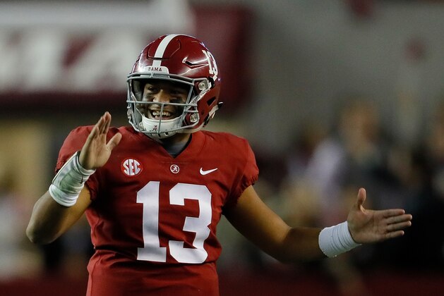 TUSCALOOSA, AL - NOVEMBER 24:  Tua Tagovailoa #13 of the Alabama Crimson Tide reacts after passing for a touchdown to DeVonta Smith #6 against the Auburn Tigers at Bryant-Denny Stadium on November 24, 2018 in Tuscaloosa, Alabama.  (Photo by Kevin C. Cox/Getty Images)