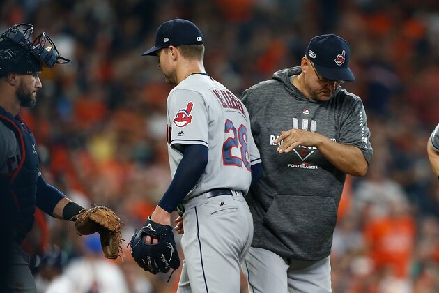 HOUSTON, TX - OCTOBER 05:  Manager Terry Francona #77 of the Cleveland Indians takes Corey Kluber #28 out of the game in the fifth inning against the Houston Astros during Game One of the American League Division Series at Minute Maid Park on October 5, 2018 in Houston, Texas.  (Photo by Bob Levey/Getty Images)