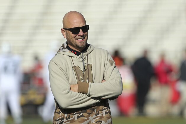CORRECTS FIRST NAME TO MATT, NOT MIKE - Maryland interim head coach Matt Canada watches his team warm up before playing Michigan State in an NCAA college football game, Saturday, Nov. 3, 2018, in College Park, Md. (AP Photo/Gary Cameron)