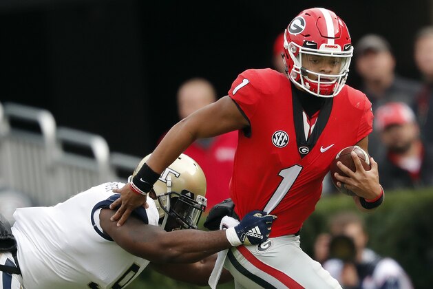Georgia quarterback Justin Fields (1) tries to escape from Georgia Tech linebacker Victor Alexander (9) in the second half of an NCAA college football game Saturday, Nov. 24, 2018, in Athens, Ga. Georgia won 45-21. (AP Photo/John Bazemore)