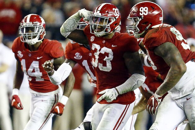 FILE - In this Saturday, Nov. 24, 2018, file photo, Alabama linebacker Anfernee Jennings (33) celebrates with teammates after an interception against Auburn during the second half of an NCAA college football game in Tuscaloosa, Ala. No. 1 Alabama's typically tough defense will be challenged by No. 4 Georgia's offense that enters Saturday's SEC championship game on a roll.  (AP Photo/Butch Dill, FIle)