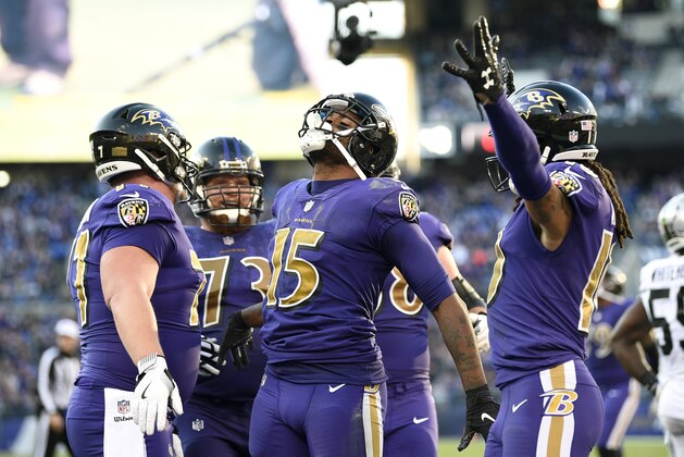 Baltimore Ravens wide receiver Michael Crabtree (15) celebrates his touchdown with teammates in the second half of an NFL football game against the Oakland Raiders, Sunday, Nov. 25, 2018, in Baltimore. (AP Photo/Nick Wass)