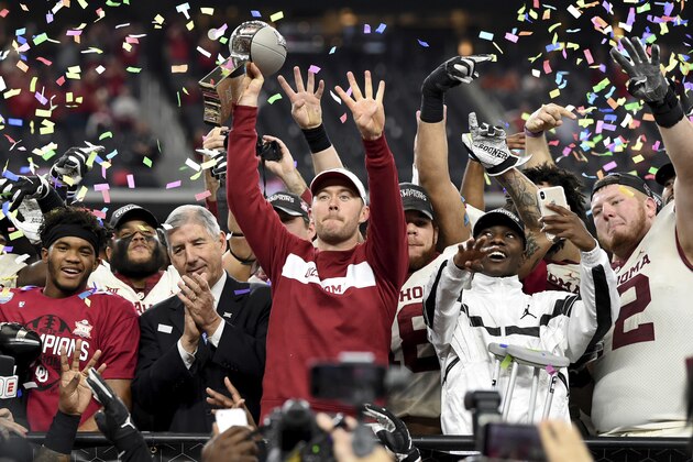 Oklahoma head coach Lincoln Riley hoists the Big 12 Conference championship trophy after beating Texas 39-27 in the Big 12 Conference championship NCAA college football game on Saturday, Dec. 1, 2018, in Arlington, Texas. (AP Photo/Jeffrey McWhorter)