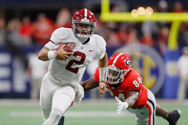 ATLANTA, GA - DECEMBER 01:  Jalen Hurts #2 of the Alabama Crimson Tide runs with the ball as Walter Grant #84 of the Georgia Bulldogs pursues him in the fourth quarter during the 2018 SEC Championship Game at Mercedes-Benz Stadium on December 1, 2018 in Atlanta, Georgia.  (Photo by Kevin C. Cox/Getty Images)