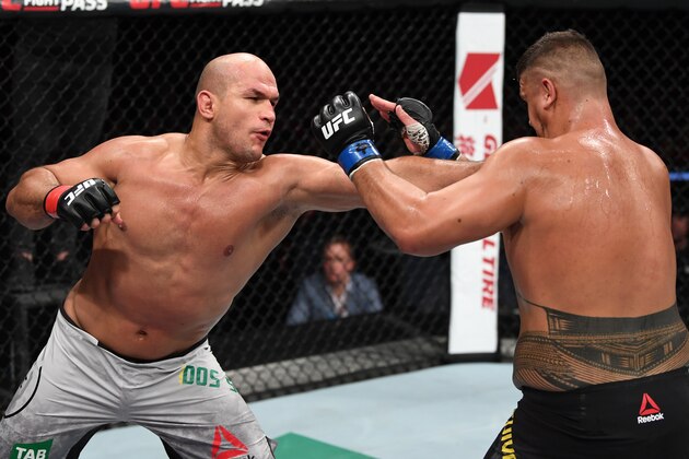 ADELAIDE, AUSTRALIA - DECEMBER 02:  (L-R) Junior Dos Santos of Brazil  punches Tai Tuivasa of Australia  in their heavyweight bout during the UFC Fight Night event inside Adelaide Entertainment Centre on December 2, 2018 in Adelaide, Australia. (Photo by Jeff Bottari/Zuffa LLC/Zuffa LLC via Getty Images)