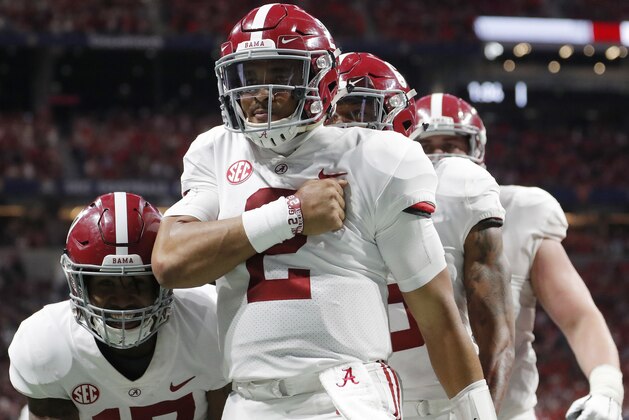 Alabama quarterback Jalen Hurts (2) celebrates his touchdown against Georgia during the second half of the Southeastern Conference championship NCAA college football game, Saturday, Dec. 1, 2018, in Atlanta. (AP Photo/John Bazemore)