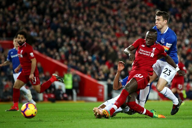 LIVERPOOL, ENGLAND - DECEMBER 02:  Sadio Mane of Liverpool shoots under pressure from Seamus Coleman of Everton during the Premier League match between Liverpool FC and Everton FC at Anfield on December 2, 2018 in Liverpool, United Kingdom.  (Photo by Clive Brunskill/Getty Images)